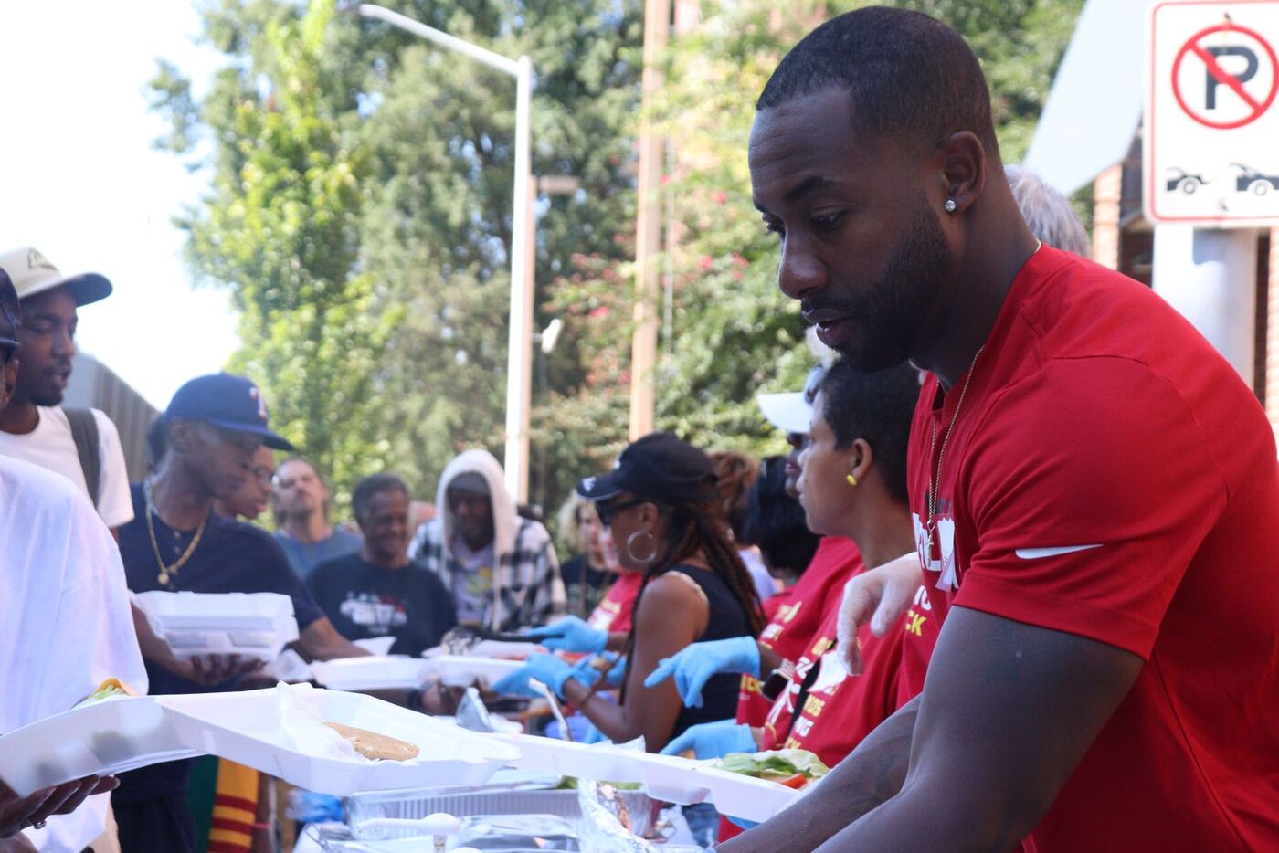 Eddie serving food at a community meal