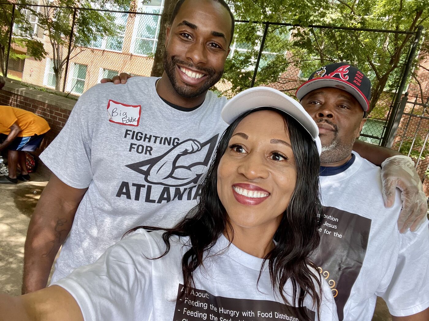 Big Eddie and volunteers together at an outreach event