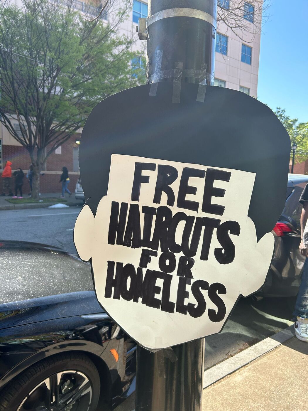 Free haircuts for the homeless event signage