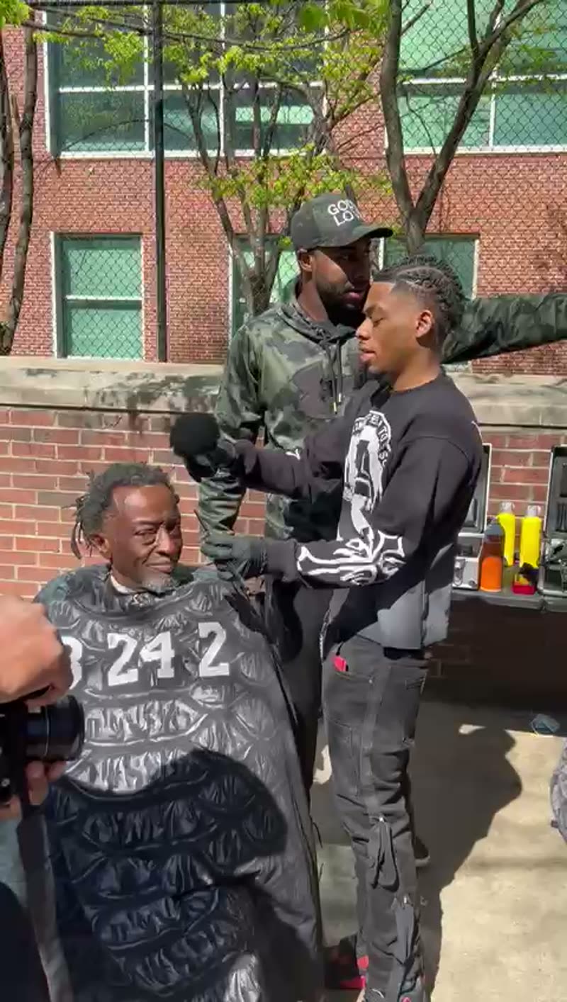Video: a fresh cut in progress at a free haircut street event